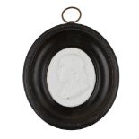 A MINIATURE GLASS PORTRAIT MEDALLION DATED 1790 inscribed under shoulder A. WAUGH M. A. 1790, framed