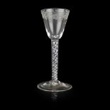 A JACOBITE WINE GLASS 18TH CENTURY the bucket bowl with engraved trailing border of flowers