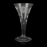 A LARGE JACOBITE GLASS GOBLET 18TH CENTURY the flared bowl engraved with a rose head flanked by open