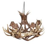 AN ANTLER CHANDELIER CONTEMPORARY the entwined antlers supporting five brass sconces, each fitted