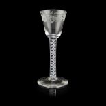 A JACOBITE WINE GLASS 18TH CENTURY the bucket bowl with engraved trailing border of flowers