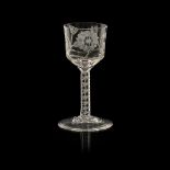 A JACOBITE STYLE WINE GLASS the large bucket bowl engraved with open rose head and a pair of open