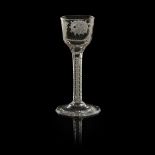A JACOBITE WINE GLASS 18TH CENTURY the bucket shaped bowl, with engraved rose head and closed bud,