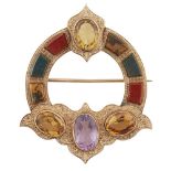 AN AGATE AND GEMSET BROOCH of lobed circular outline, collet set with four oval shaped citrines