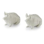 A PAIR OF SMALL WEMYSS WARE PIGS EARLY 20TH CENTURY each covered in a white glaze, apparently