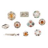 A COLLECTION OF SCOTTISH BROOCHES of various designs, each set throughout with agates and pastes,