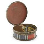 A HIDDEN PORTRAIT JACOBITE ENAMEL SNUFF BOX MID-18TH CENTURY the circular box with enamel tartan