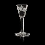 A JACOBITE INTEREST WINE GLASS the bucket bowl with engraved trailing border of rose heads and