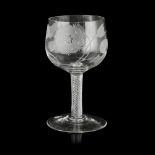A LARGE JACOBITE ENGRAVED GLASS GOBLET 18TH CENTURY the rounded bowl engraved with a rose head