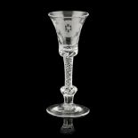 A JACOBITE ENGRAVED WINE GLASS 18TH CENTURY the flared bowl engraved with a rose head flanked by