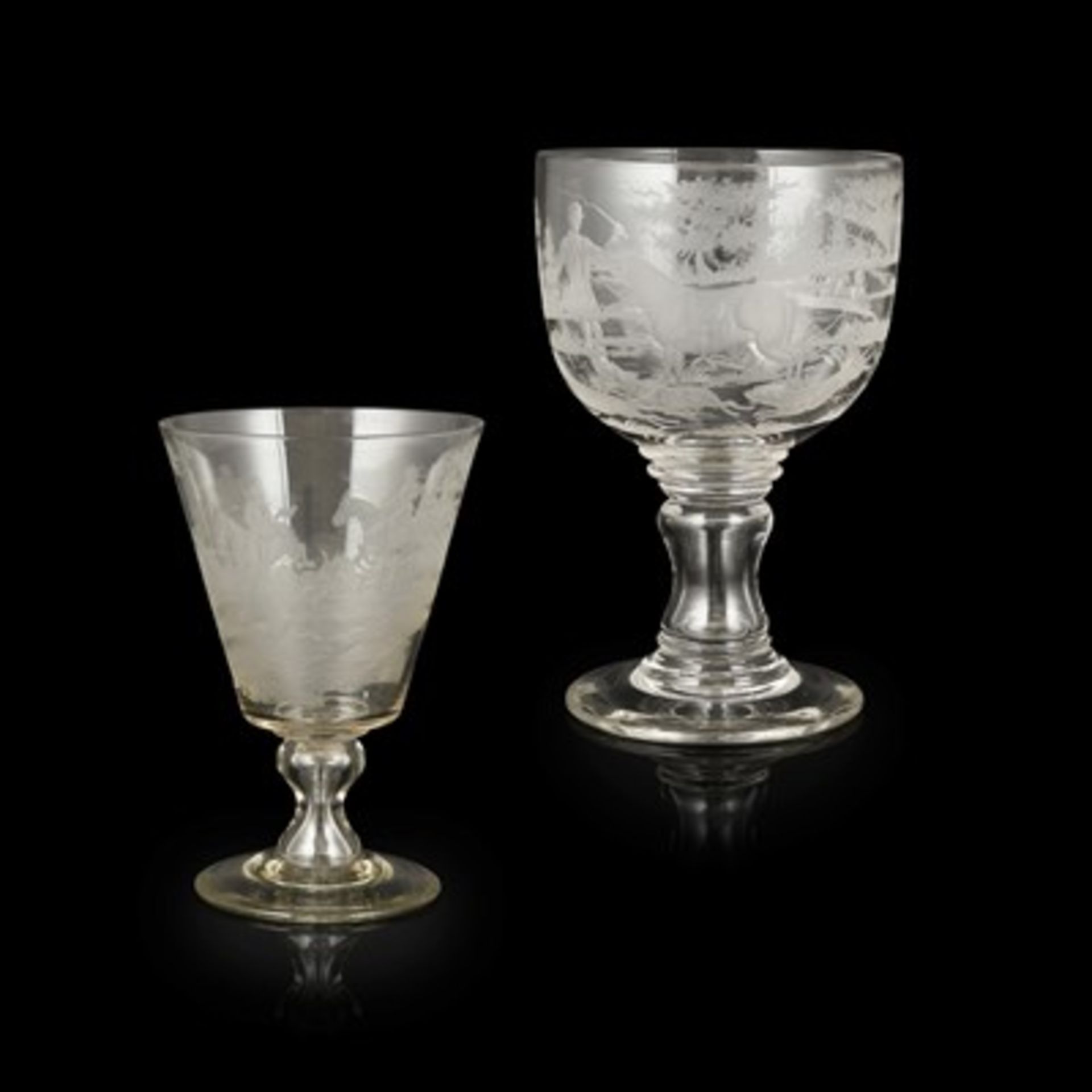 TWO LARGE ENGRAVED HUNTING GLASS GOBLETS EARLY 19TH CENTURY the first with a large rounded bowl