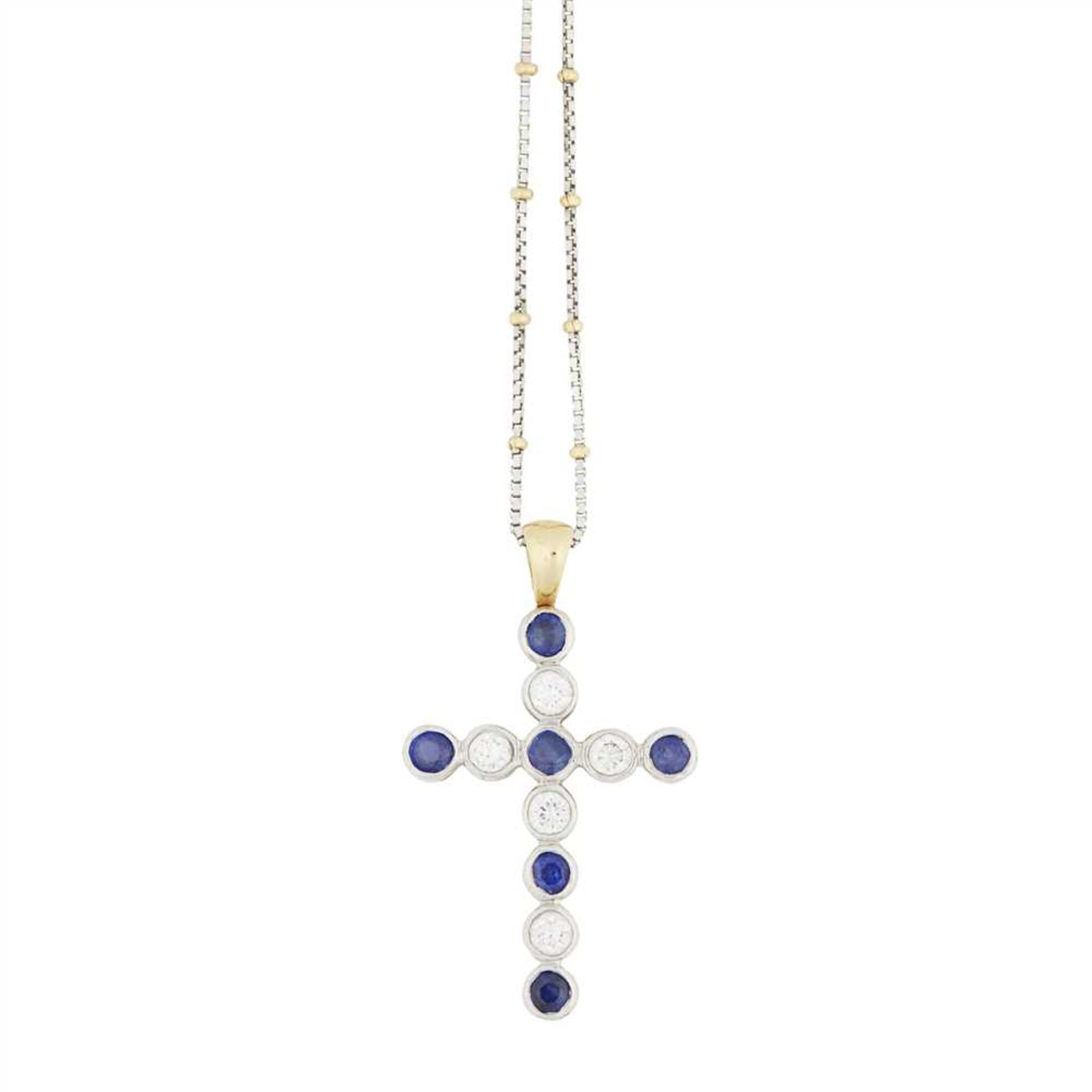 A 18ct gold sapphire and diamond set cross the cross composed of six collet set sapphires and five