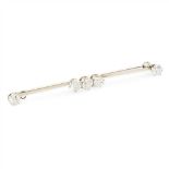 A five stone diamond set bar brooch the knife-bar claw set with five round cut diamonds, stamped