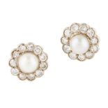 A pair of pearl and diamond set cluster earrings each set with a pearl in a single border of