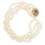 A double strand pearl necklace composed of two strands of uniform cultured pearls, to a circular