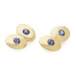 A pair of gentleman's sapphire set cufflinks each oval terminal gypsy set with a round or cushion