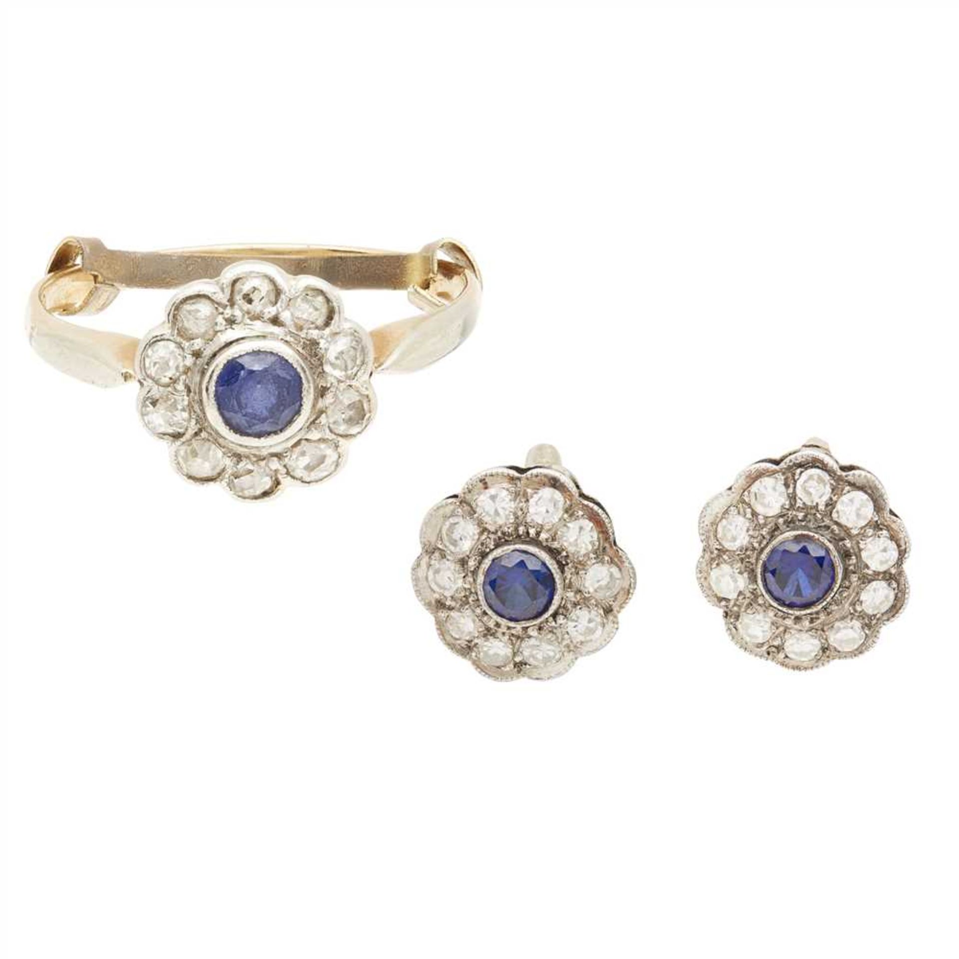 A pair of sapphire and diamond set earrings collet set with a circular cut sapphire in a border of