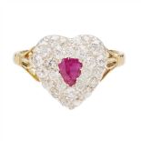 A ruby and diamond set ring modelled as a heart, collet set with a pear cut ruby in a double