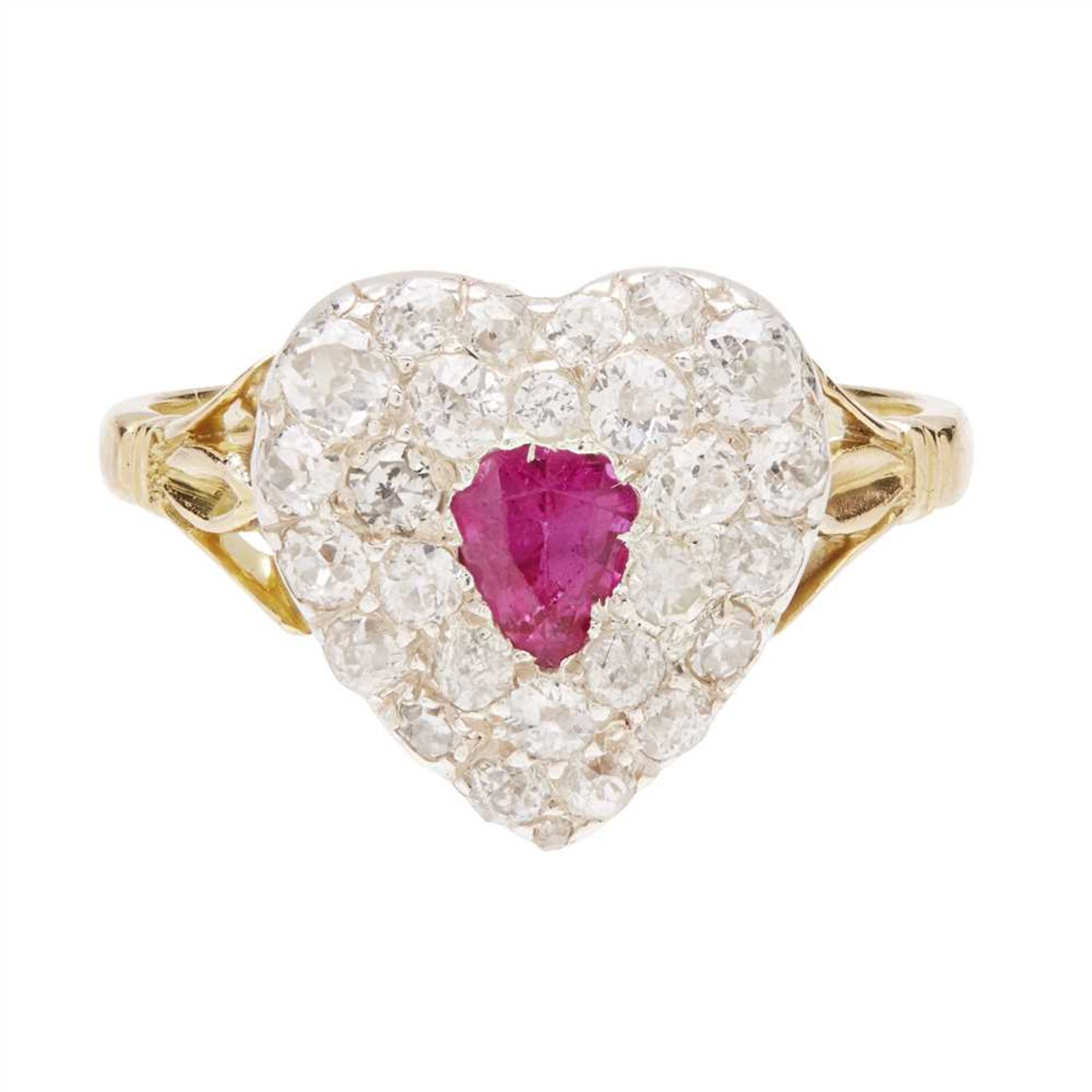 A ruby and diamond set ring modelled as a heart, collet set with a pear cut ruby in a double