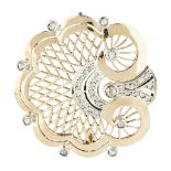 A mid-century diamond set brooch modelled as a stylised shell with pierced detail, rose cut