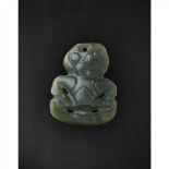 MAORI NECK PENDANT, HEI-TIKI NEW ZEALAND carved nephrite, the ornament with carved features, the