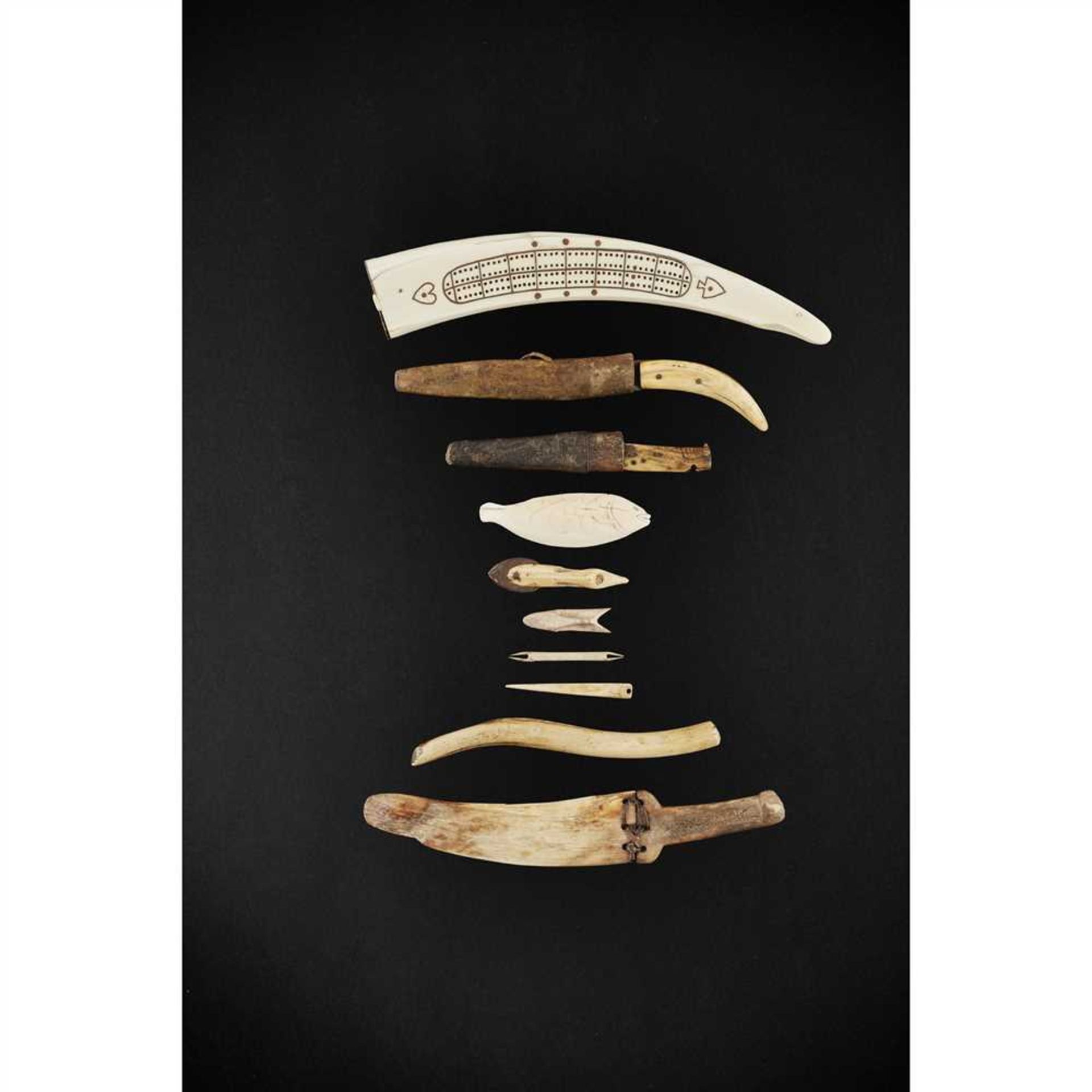 COLLECTION OF INUIT ARTEFACTS ARCTIC carved marine ivory, wood, leather and metal, the collection