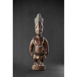 IBEJI FIGURE, ERE IBEJI OYO, NIGERIA carved wood and beads, produced in the style of the Igbuke of