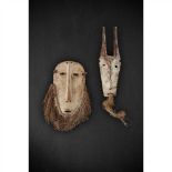PAIR OF LEGA MASKS DEMOCRATIC REPUBLIC OF CONGO carved wood, one horned, both with kaolin and