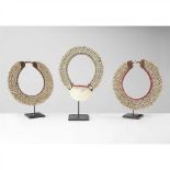 THREE SHELL NECKLACES PAPUA NEW GUINEA fibre, kina shell and cowrie shell, presented on bespoke