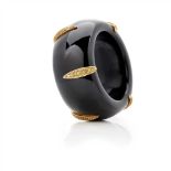 An onyx and yellow sapphire set bangle