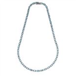 A topaz and diamond set line necklace