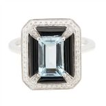 An aquamarine, onyx and diamond set ring