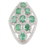 A diamond and emerald set pendant