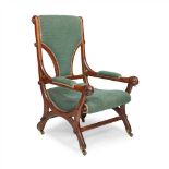 ENGLISH SCHOOL GOTHIC REVIVAL OAK ARMCHAIR, CIRCA 1870 with later-upholstered back and seat,