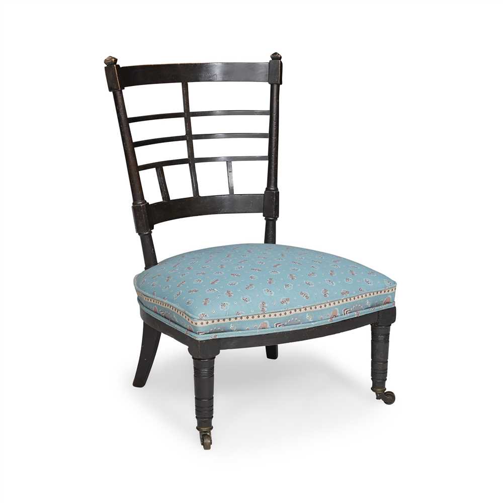 AFTER EDWARD WILLIAM GODWIN AESTHETIC MOVEMENT EBONISED LOW CHAIR, CIRCA 1880 with lattice-back