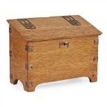 ENGLISH SCHOOL ARTS & CRAFTS OAK AND BRASS MOUNTED STATIONERY BOX, CIRCA 1910 the sloping lid