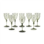 THOMAS GRAHAM JACKSON (1835-1924) FOR JAMES POWELL & SONS SET OF EIGHT OLIVE GREEN DRINKING GLASSES,