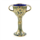 WILLIAM MOORCROFT (1872-1945) FOR JAMES MACINTYRE & CO. ‘GREEN AND GOLD’ FLORIAN WARE TWIN-HANDLED