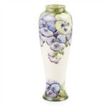 WILLIAM MOORCROFT (1872-1945) FOR JAMES MACINTYRE & CO. TALL ‘PANSY’ BALUSTER VASE, CIRCA 1918