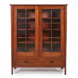 MANNER OF GEORGE HENRY WALTON MAHOGANY DISPLAY CABINET, CIRCA 1910 the projecting cornice above