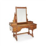 GILLOW & CO., LANCASTER GOTHIC REVIVAL OAK DRESSING TABLE, CIRCA 1880 the crested swing mirror above