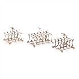 HEATH & MIDDLETON, IN THE MANNER OF CHRISTOPHER DRESSER GROUP OF THREE ELECTROPLATED TOAST RACKS,