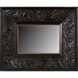 ENGLISH SCHOOL ARTS & CRAFTS EBONISED WALL MIRROR, CIRCA 1900 the rectangular bevelled plate