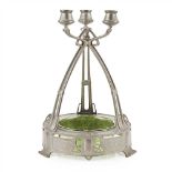 GERMAN SCHOOL JUGENDSTIL PEWTER AND GLASS CENTREPIECE, CIRCA 1900 cast as three uprights meeting