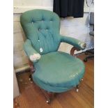 A Victorian open armchair, the button back on scroll arms and moulded cabriole legs with pot