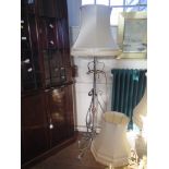 A Victorian brushed wrought metal and copper standard lamp, converted into electricity, with