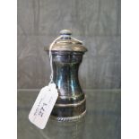 A silver pepper mill