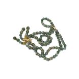 A green bead necklace with 9 carat gold fittings