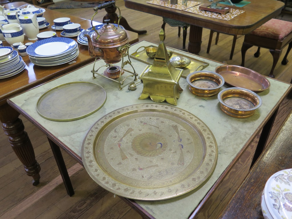 A brass and copper spirit kettle, three brass trays, a Victorian brass money box and other