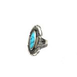 A silver and turquoise ring